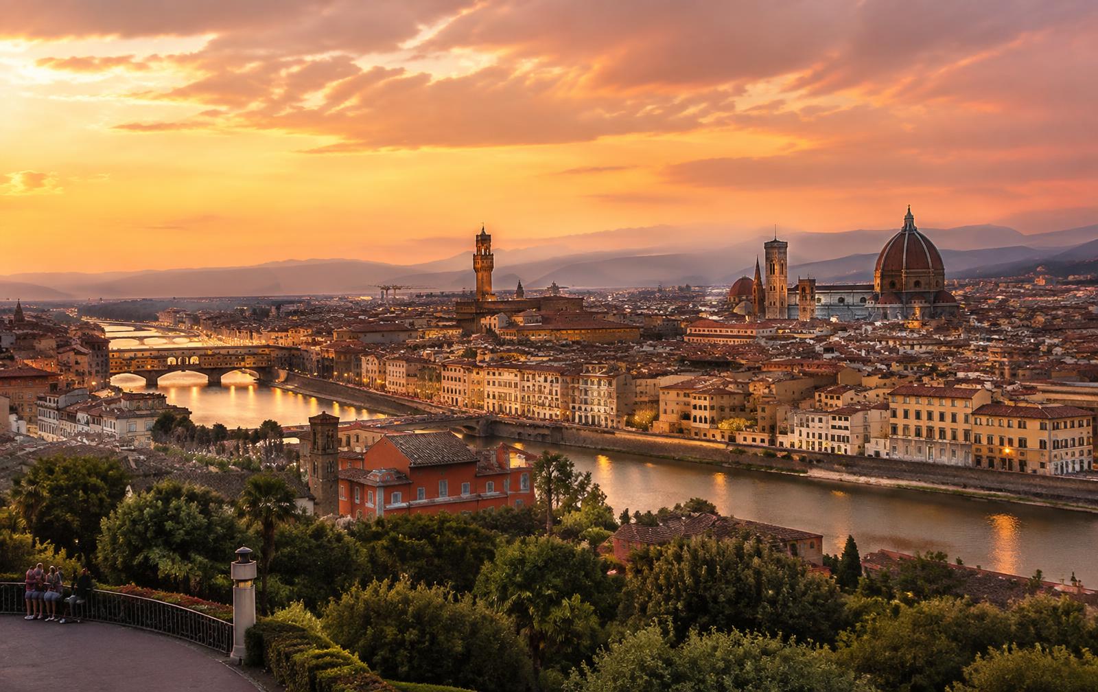 Florence skyline at sunset with the Duomo and Ponte Vecchio over the Arno
